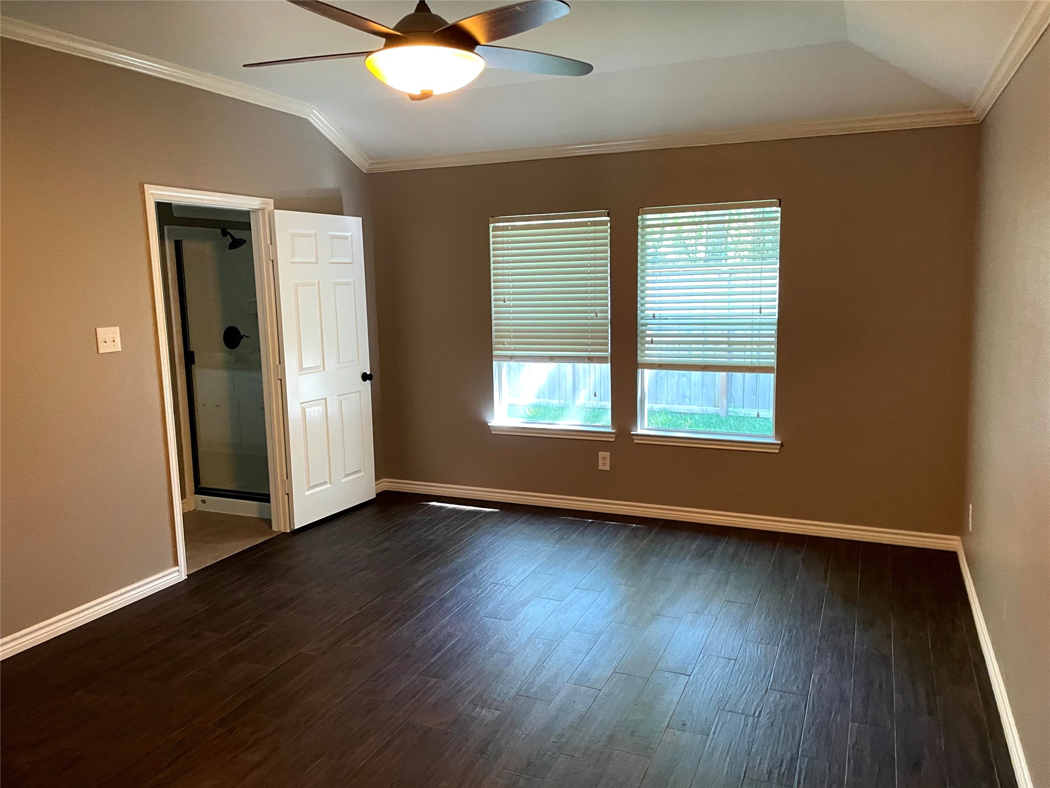 2314 Colonial Springs Lane Spring, TX 77386 - Photo 11 of 22 a view of an empty room with wooden floor and a window
