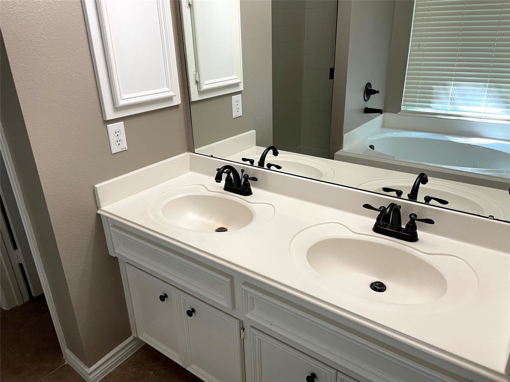 2314 Colonial Springs Lane Spring, TX 77386 - Photo 17 of 22 a bathroom with a sink and a mirror