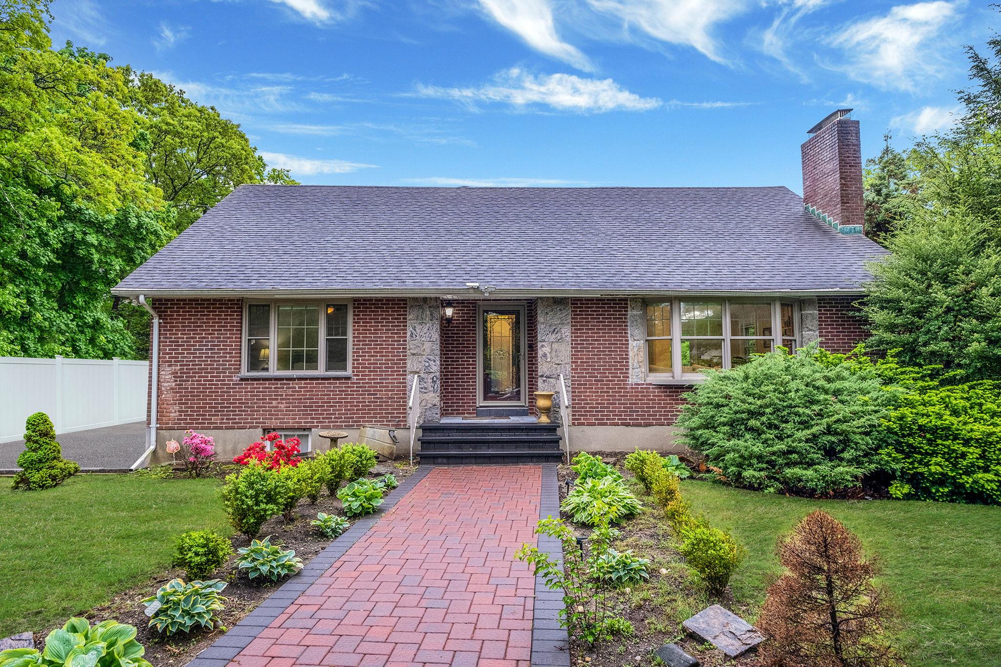 a front view of a house with a yard