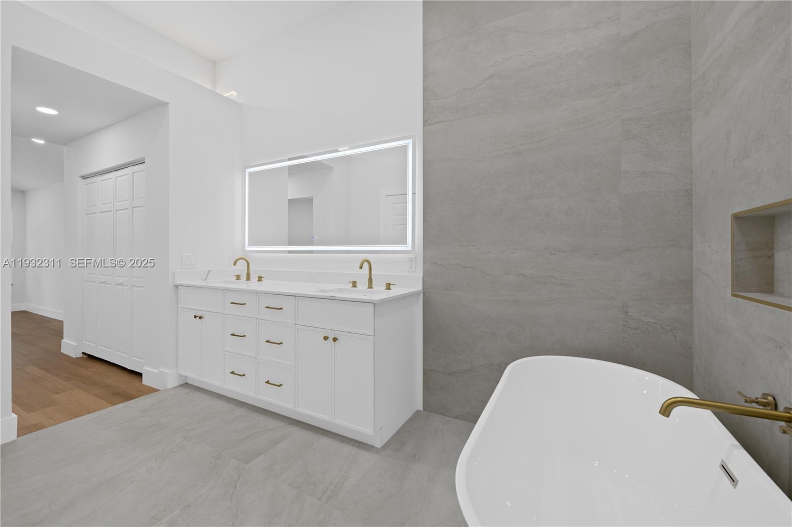 2014 Northwest 52nd Street Boca Raton, FL 33496 - Photo 11 of 26 a bathroom with a sink and a mirror