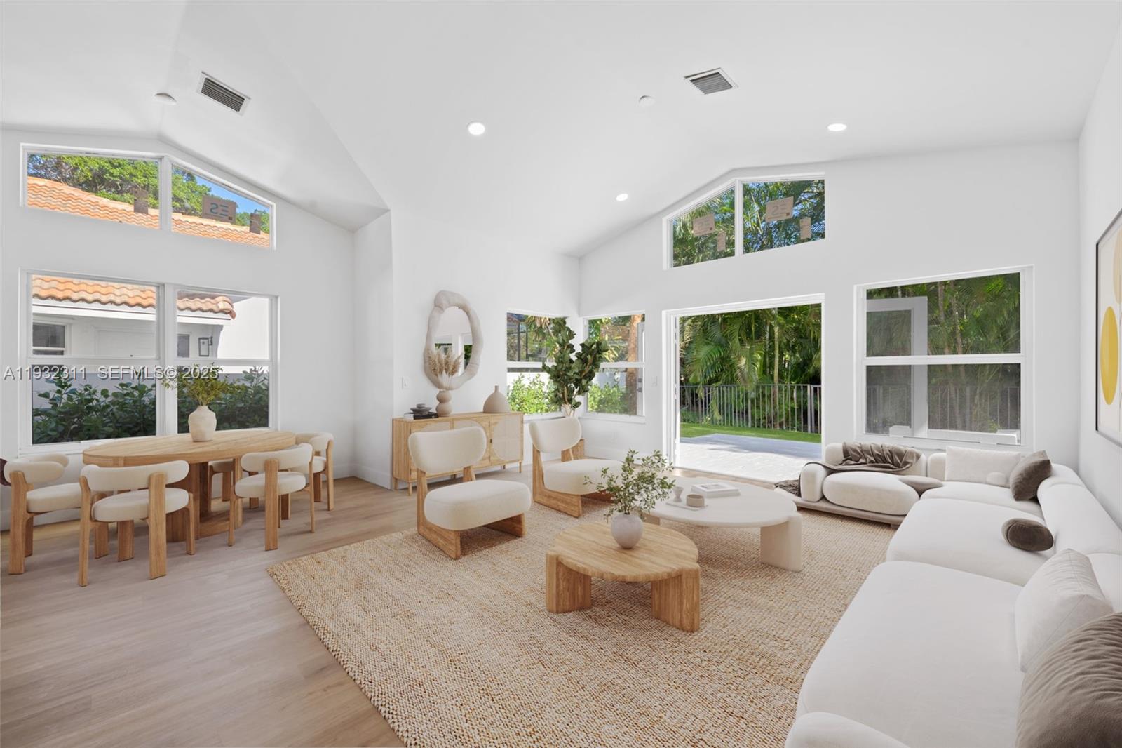 2014 Northwest 52nd Street Boca Raton, FL 33496 - Photo 2 of 26 a living room with furniture and a large window