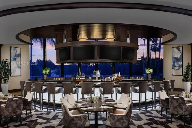 a very nice looking dining room with many windows