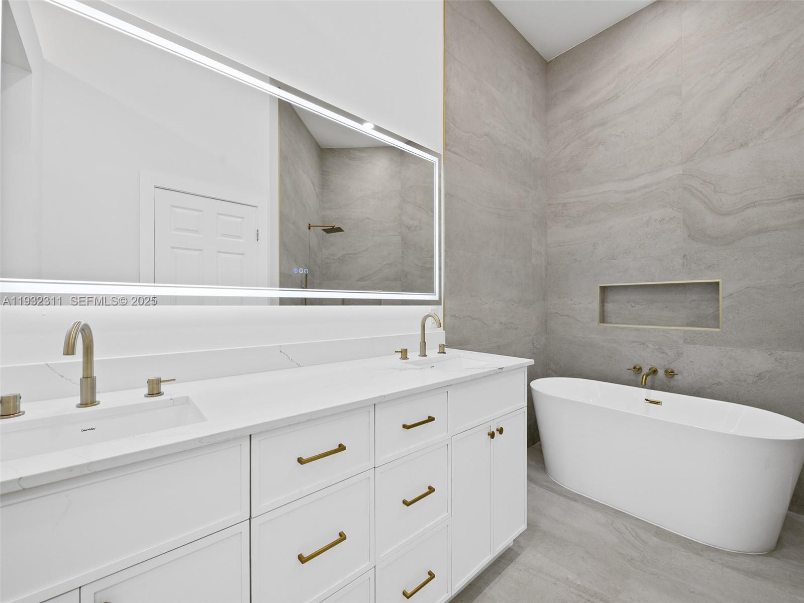 2014 Northwest 52nd Street Boca Raton, FL 33496 - Photo 10 of 26 a bathroom with a sink and a bathtub