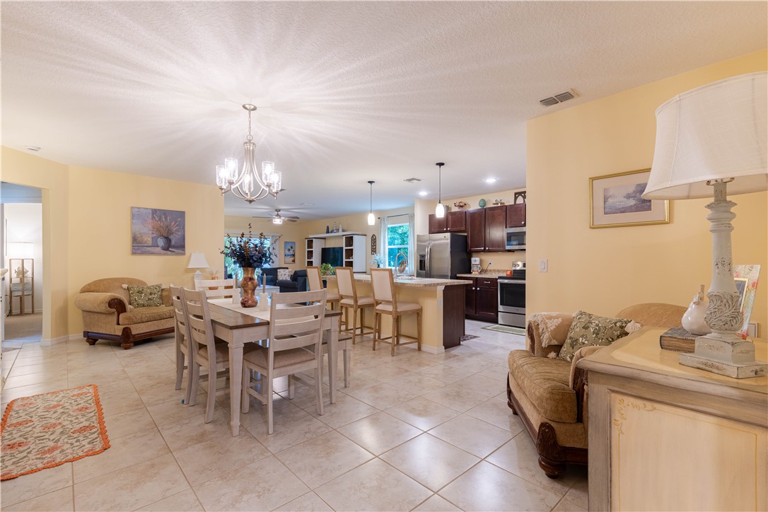898 Lorca Avenue Sebastian, FL 32958 - Photo 11 of 36 a view of a dining area with furniture
