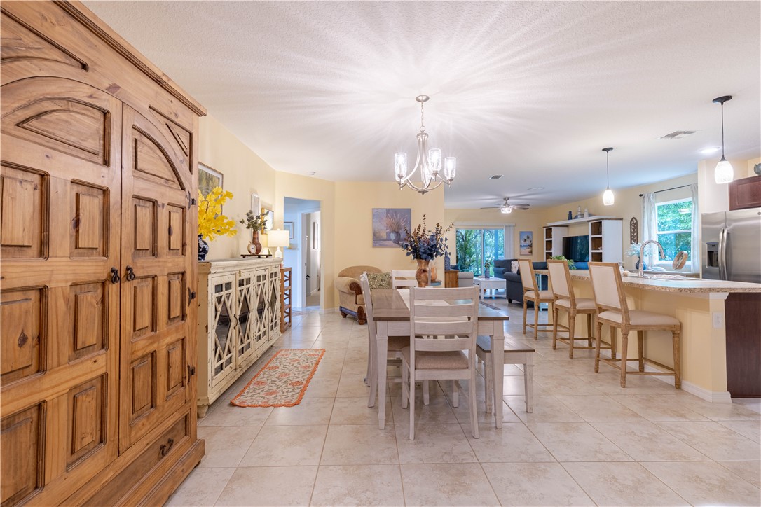 898 Lorca Avenue Sebastian, FL 32958 - Photo 13 of 36 a large kitchen with a table and chairs