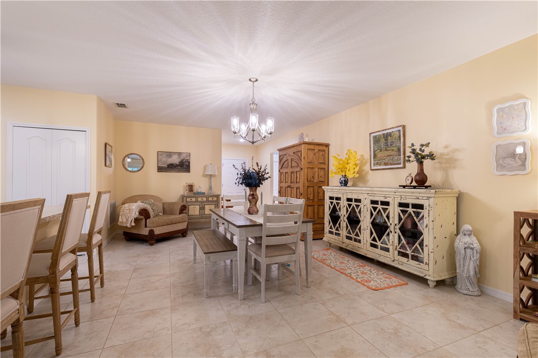 898 Lorca Avenue Sebastian, FL 32958 - Photo 14 of 36 a theatre with furniture and chandelier
