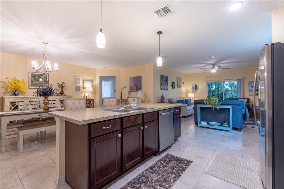 898 Lorca Avenue Sebastian, FL 32958 - Photo 18 of 36 a large kitchen with a counter space a sink and appliances