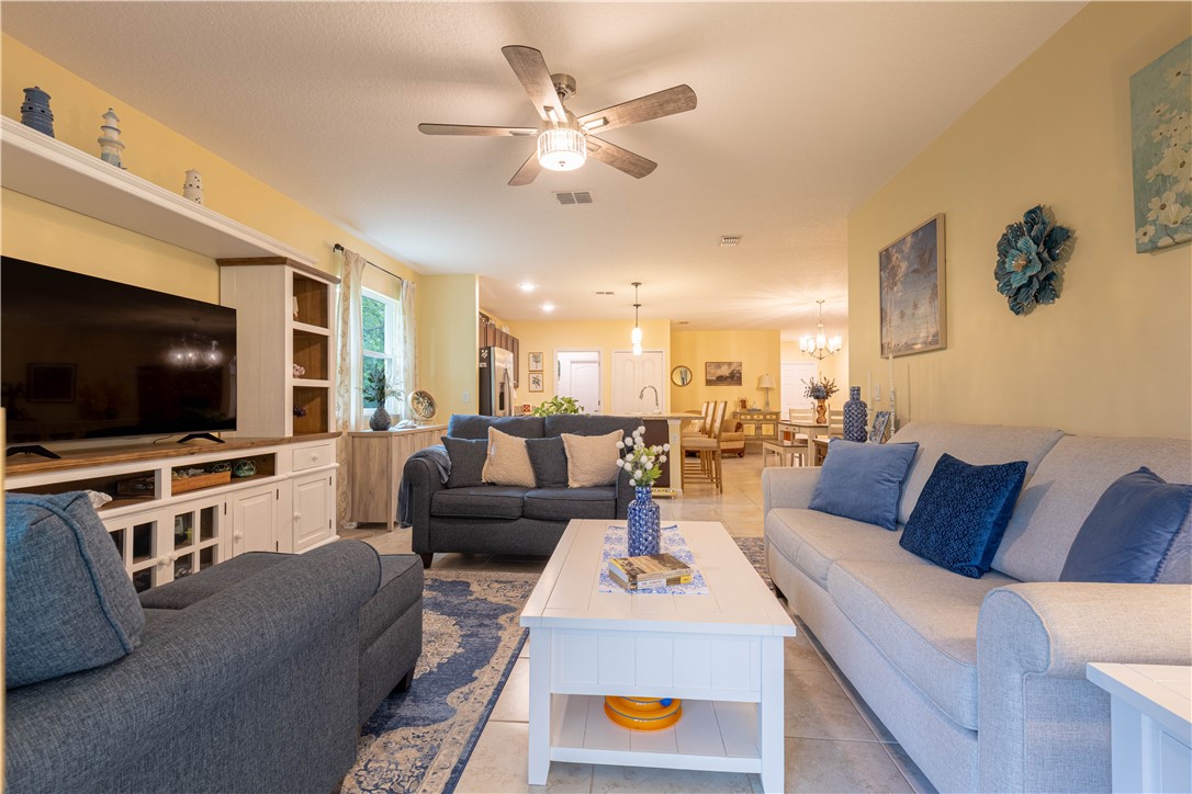 898 Lorca Avenue Sebastian, FL 32958 - Photo 21 of 36 a living room with furniture and a flat screen tv