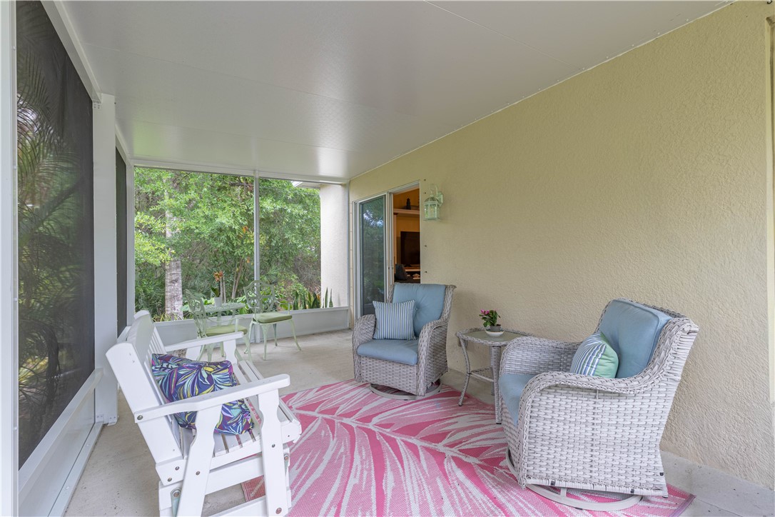 898 Lorca Avenue Sebastian, FL 32958 - Photo 25 of 36 a living room with furniture and a large window