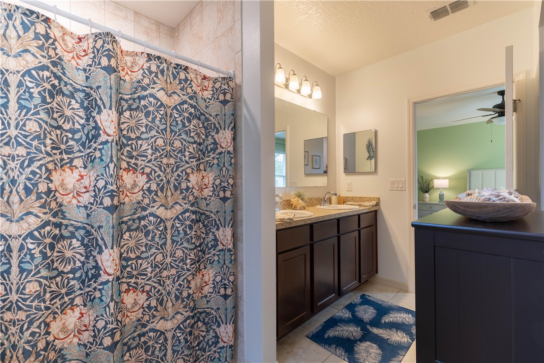 898 Lorca Avenue Sebastian, FL 32958 - Photo 35 of 36 a spacious bathroom with a shower and a sink