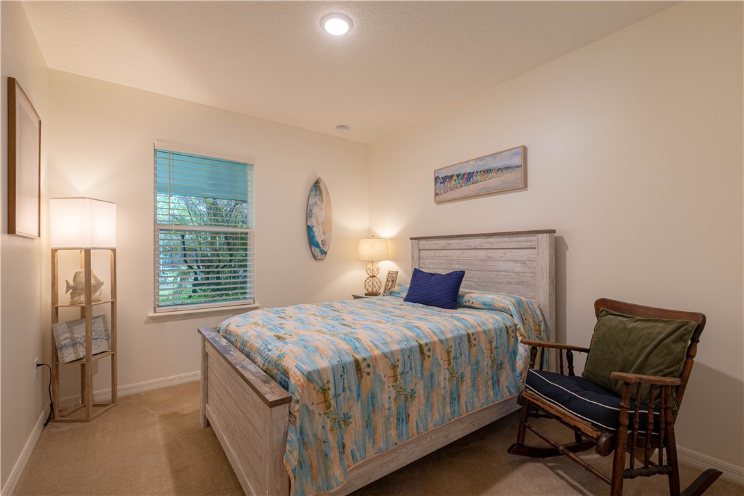 898 Lorca Avenue Sebastian, FL 32958 - Photo 36 of 36 a bedroom with a bed and wooden floor