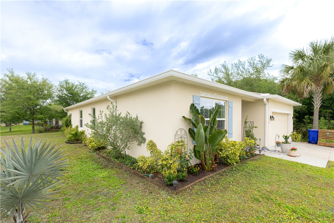 898 Lorca Avenue Sebastian, FL 32958 - Photo 4 of 36 a view of a house with backyard and garden