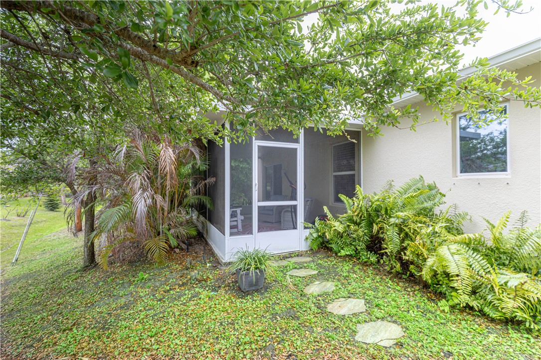 898 Lorca Avenue Sebastian, FL 32958 - Photo 6 of 36 a view of house with a yard and potted plants