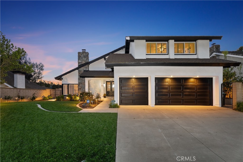 31041 Augusta Drive Laguna Niguel, CA 92677 - Photo 1 of 35 a front view of a house with a yard and garage