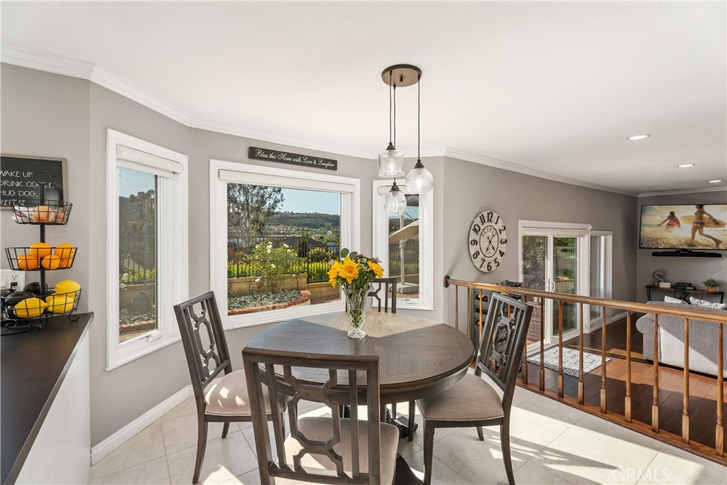 31041 Augusta Drive Laguna Niguel, CA 92677 - Photo 11 of 35 a view of a dining room with furniture and wooden floor