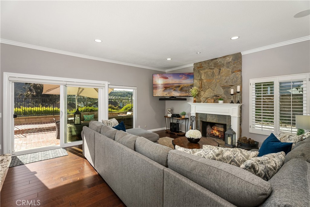 31041 Augusta Drive Laguna Niguel, CA 92677 - Photo 13 of 35 a living room with furniture fireplace and a large window