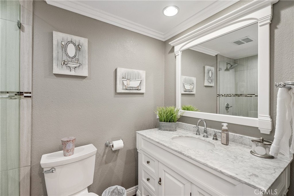 31041 Augusta Drive Laguna Niguel, CA 92677 - Photo 17 of 35 a bathroom with a granite countertop sink mirror and toilet