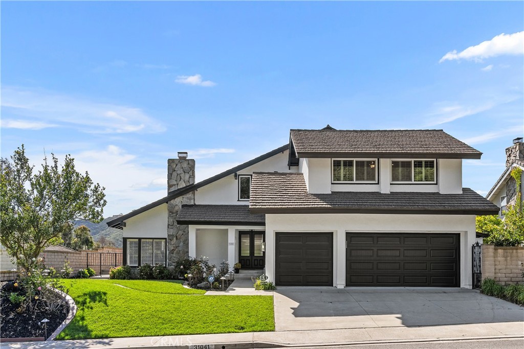 31041 Augusta Drive Laguna Niguel, CA 92677 - Photo 2 of 35 a front view of a house with a garden