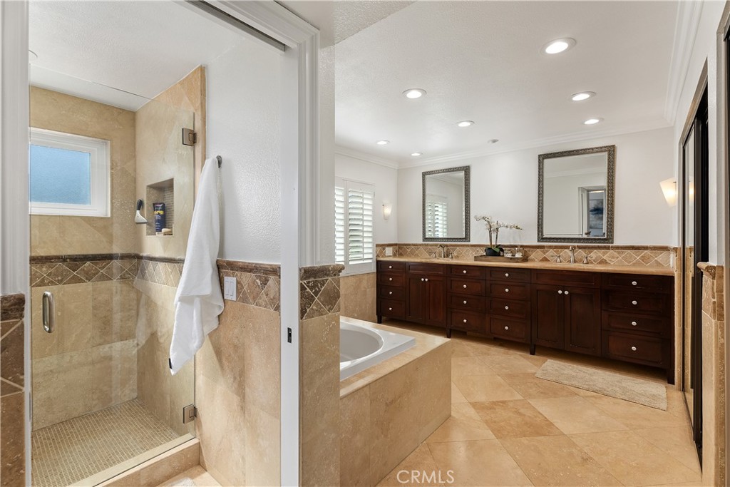 31041 Augusta Drive Laguna Niguel, CA 92677 - Photo 21 of 35 a spacious bathroom with a double vanity sink and a mirror