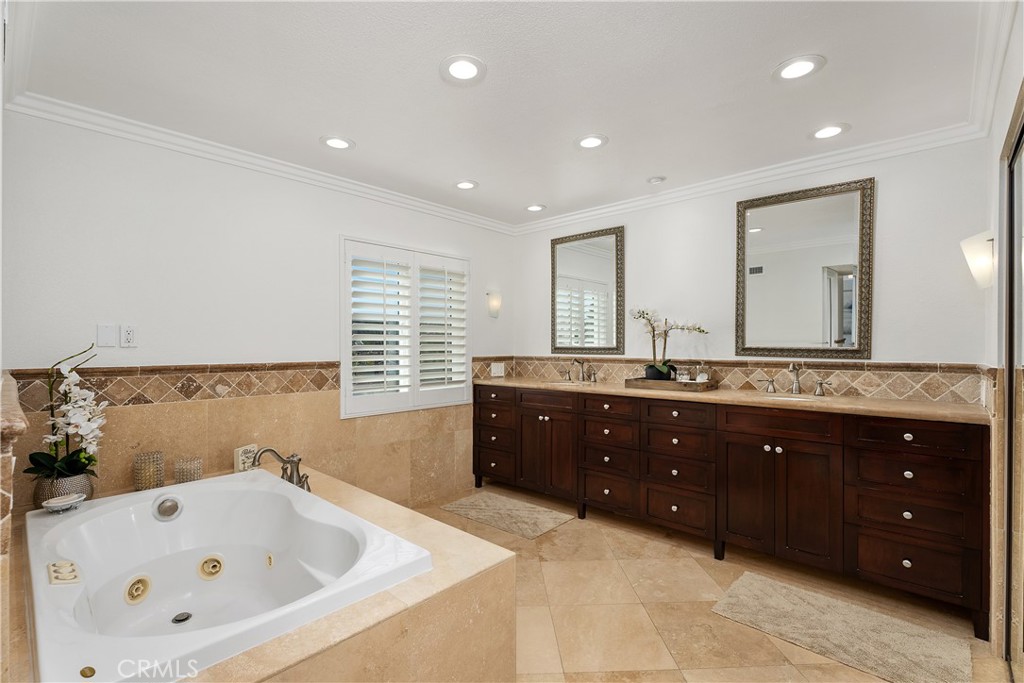 31041 Augusta Drive Laguna Niguel, CA 92677 - Photo 22 of 35 a spacious bathroom with a tub sink and mirror