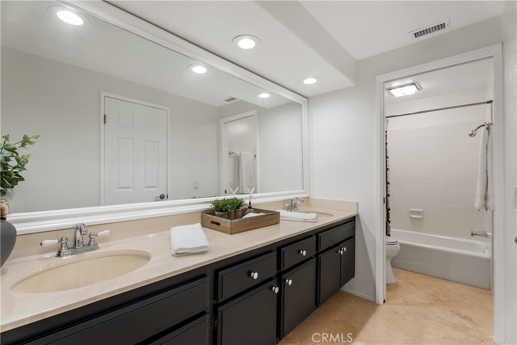 31041 Augusta Drive Laguna Niguel, CA 92677 - Photo 26 of 35 a bathroom with a granite countertop sink mirror and double