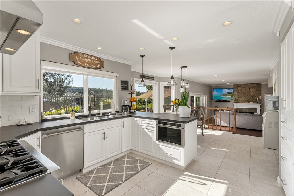 31041 Augusta Drive Laguna Niguel, CA 92677 - Photo 8 of 35 a kitchen with a sink stainless steel appliances and cabinets