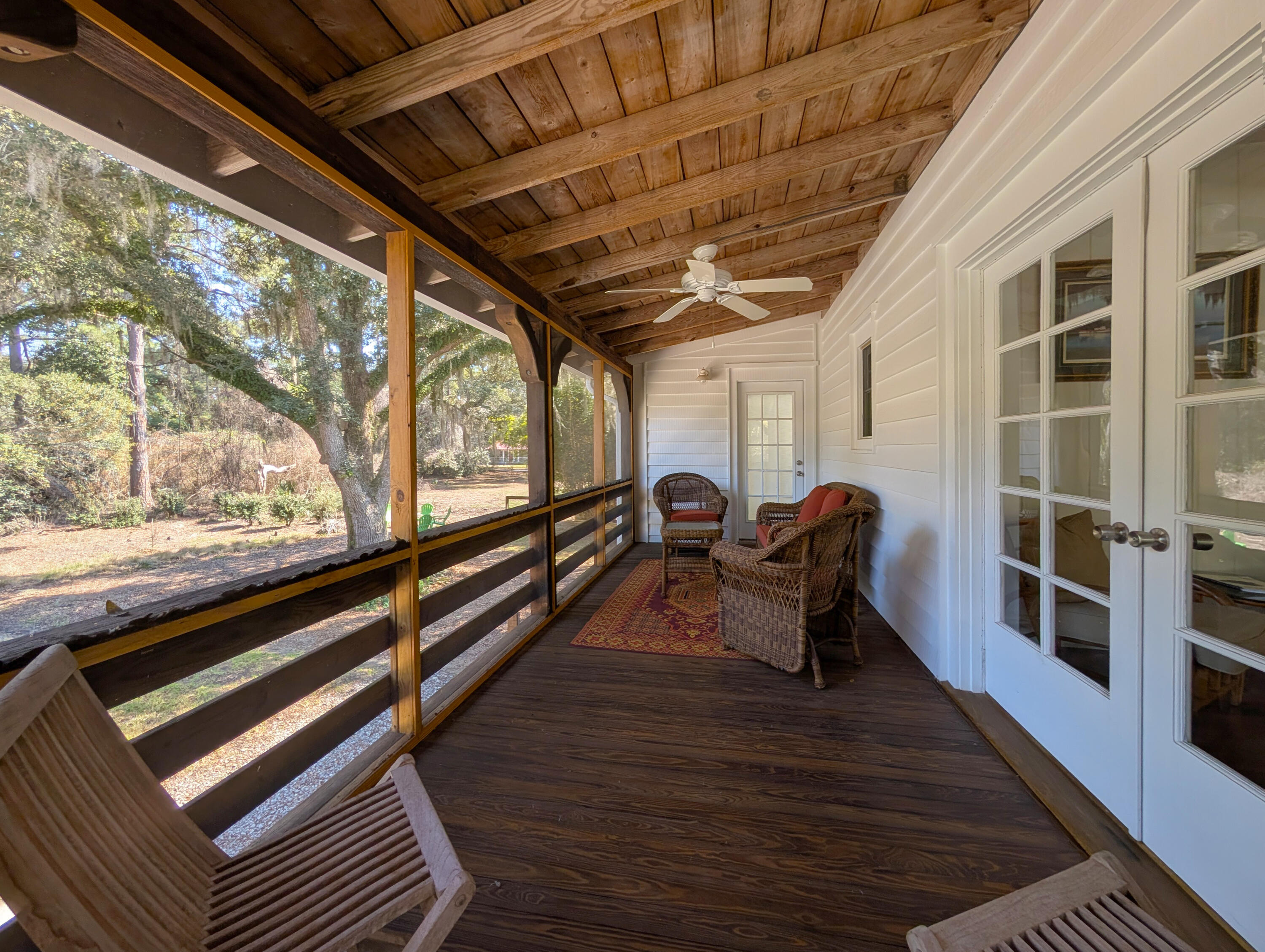 123 Cassena Street McClellanville, SC 29458 - Photo 8 of 37 7-Left-Screened-Porch