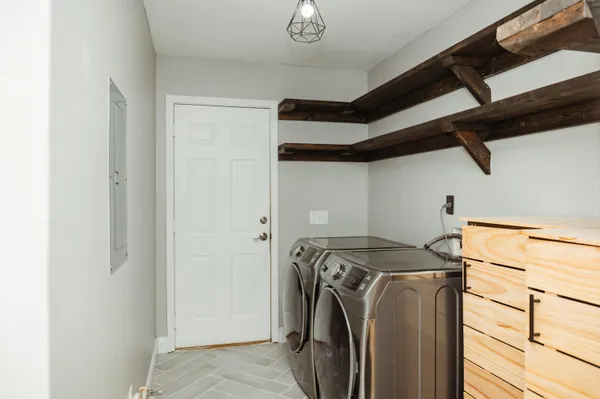 a view of a storage & utility room with washer and dryer