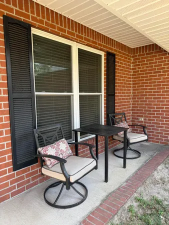 a building outdoor space with patio furniture