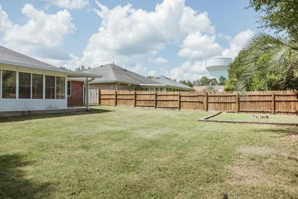 a view of backyard with green space