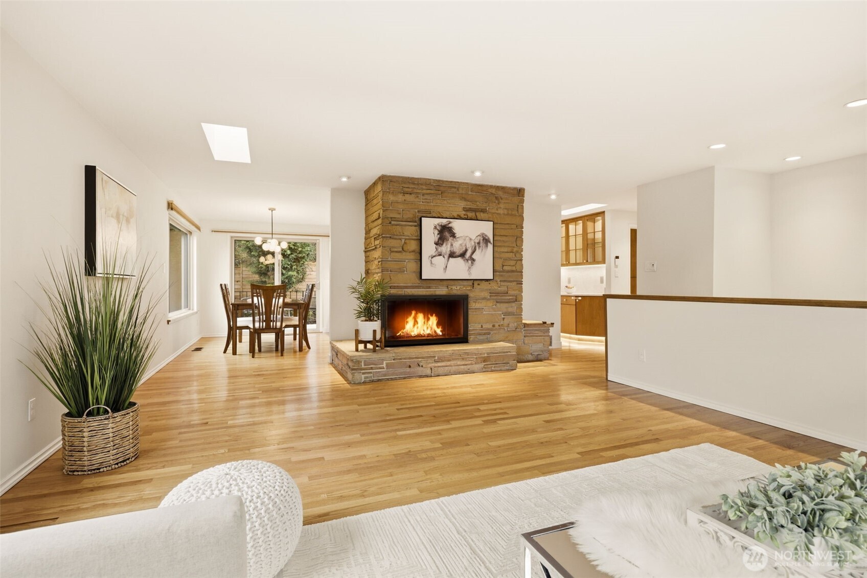 3601 Northeast 100th Street Seattle, WA 98115 - Photo 11 of 37 a living room with furniture wooden floor and a fireplace