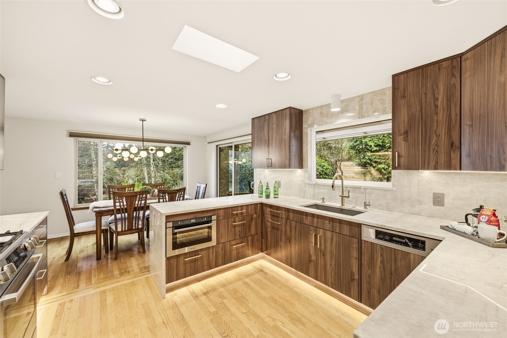 3601 Northeast 100th Street Seattle, WA 98115 - Photo 16 of 37 a kitchen with lots of counter top space and dining table