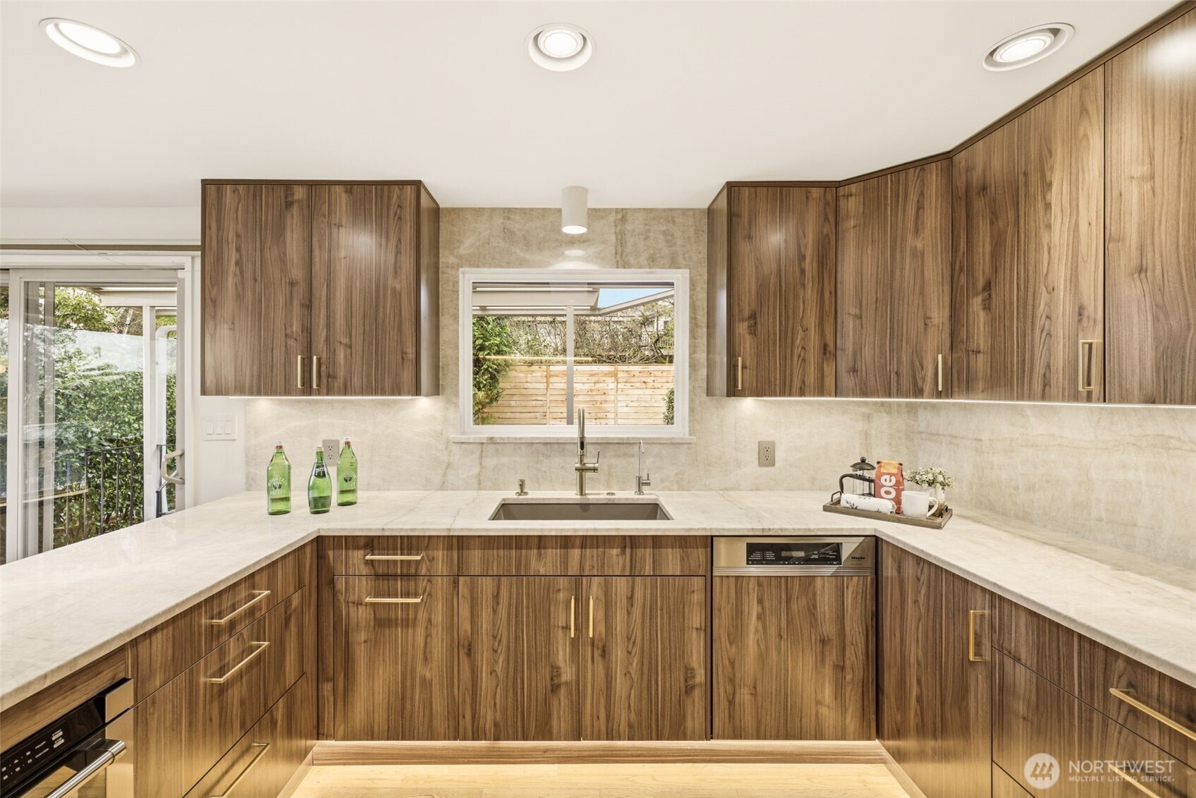 3601 Northeast 100th Street Seattle, WA 98115 - Photo 17 of 37 a kitchen with a sink a window and cabinets