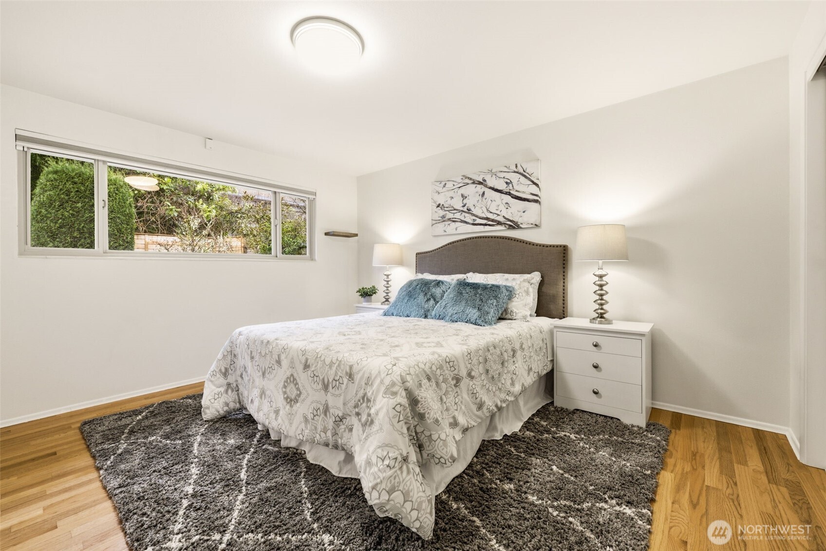 3601 Northeast 100th Street Seattle, WA 98115 - Photo 19 of 37 a bedroom with a bed and a window