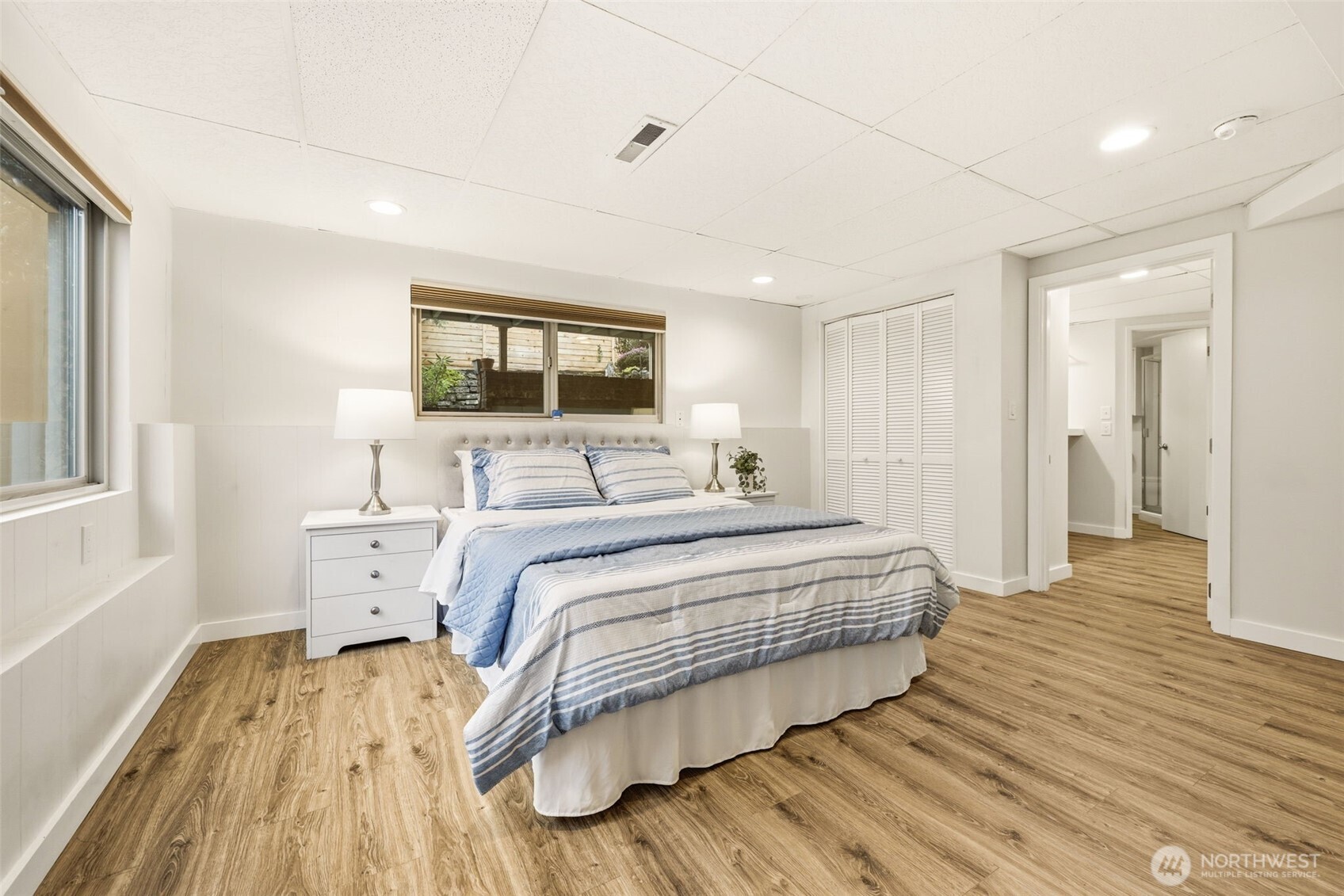 3601 Northeast 100th Street Seattle, WA 98115 - Photo 27 of 37 a bedroom with a bed and wooden floor