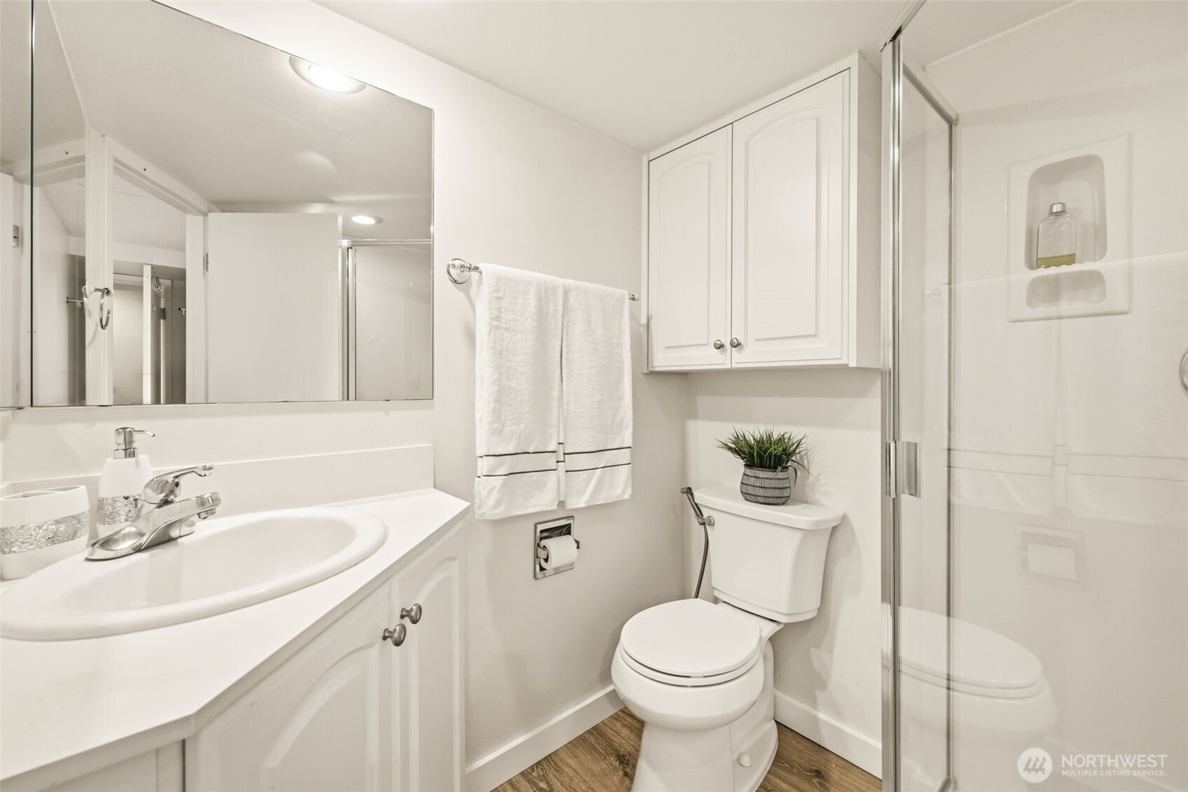 3601 Northeast 100th Street Seattle, WA 98115 - Photo 29 of 37 a bathroom with a sink a toilet and shower