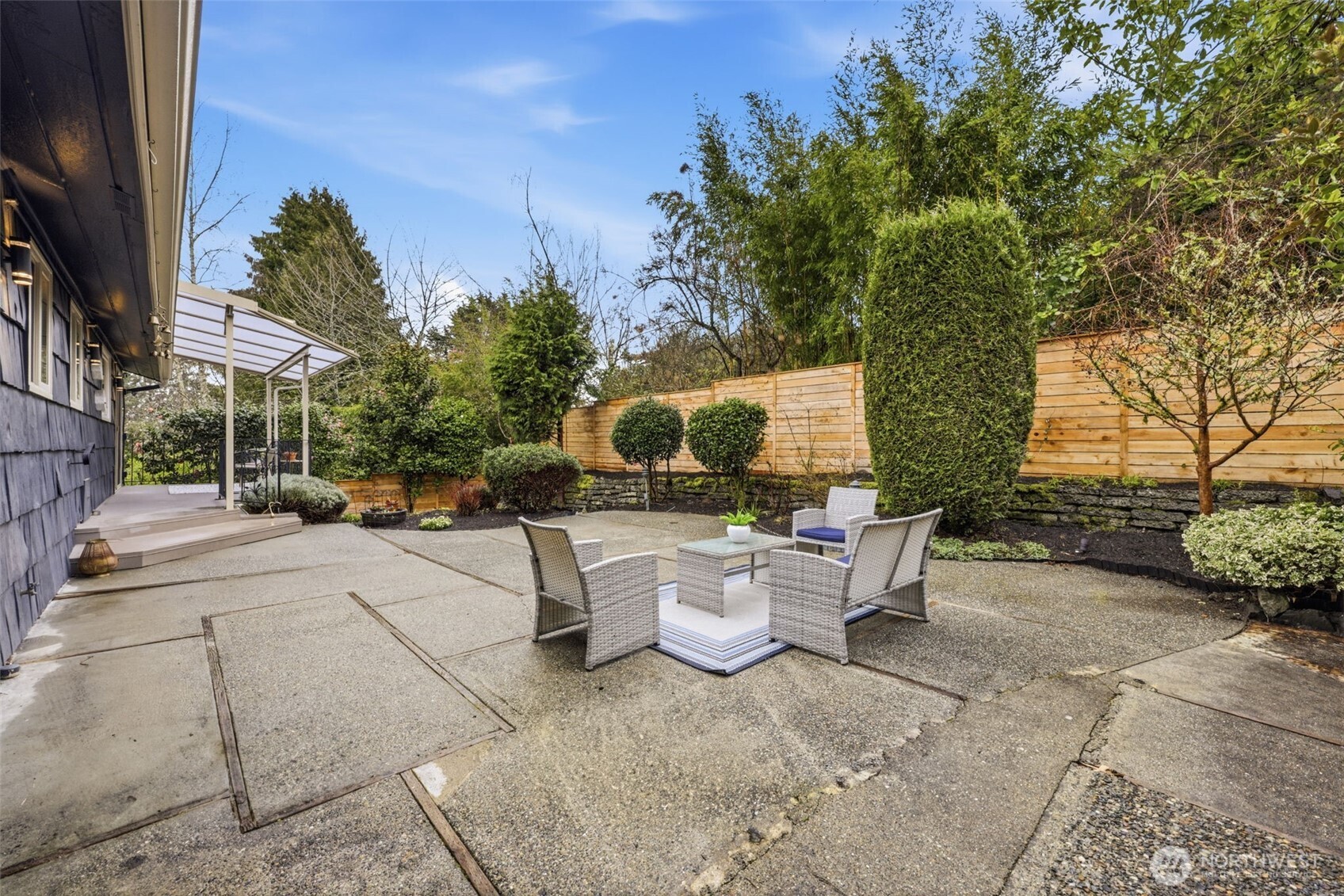 3601 Northeast 100th Street Seattle, WA 98115 - Photo 33 of 37 a view of a patio with couches and table and chairs and potted plants