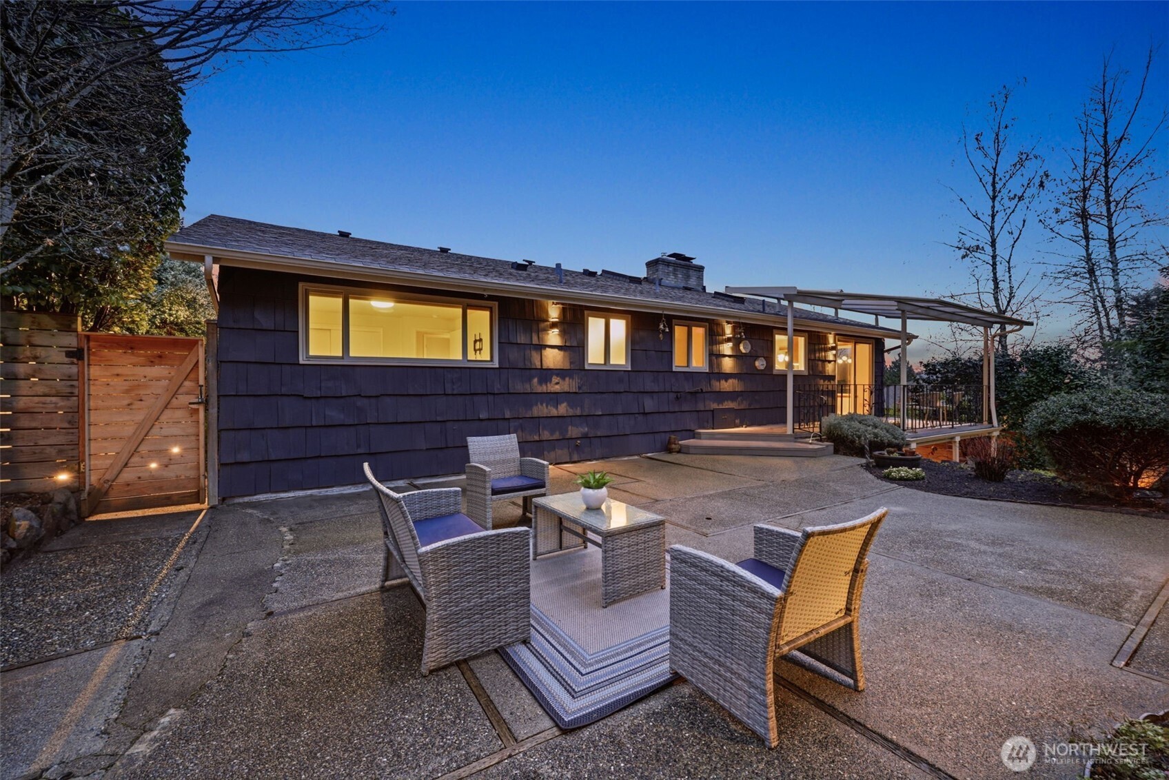 3601 Northeast 100th Street Seattle, WA 98115 - Photo 34 of 37 a view of a patio with table and chairs with wooden fence