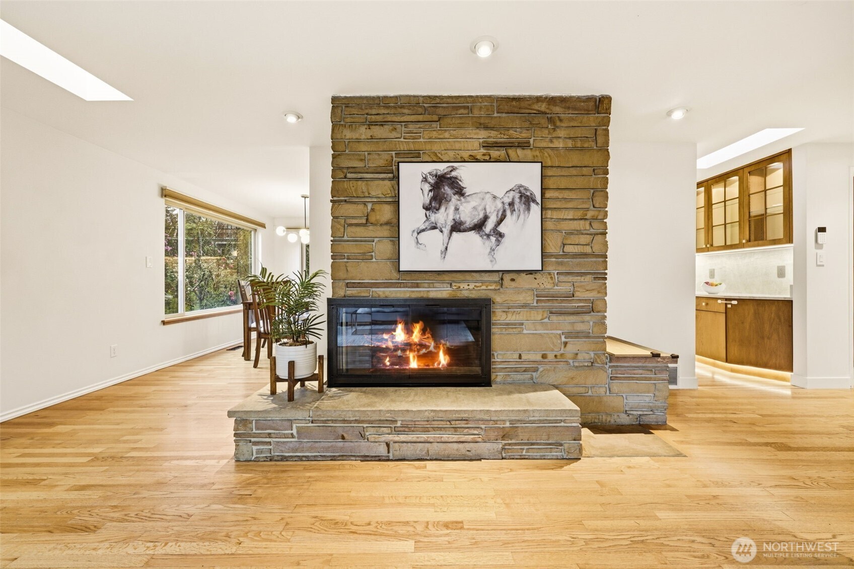 3601 Northeast 100th Street Seattle, WA 98115 - Photo 10 of 37 a living room with furniture and a fireplace