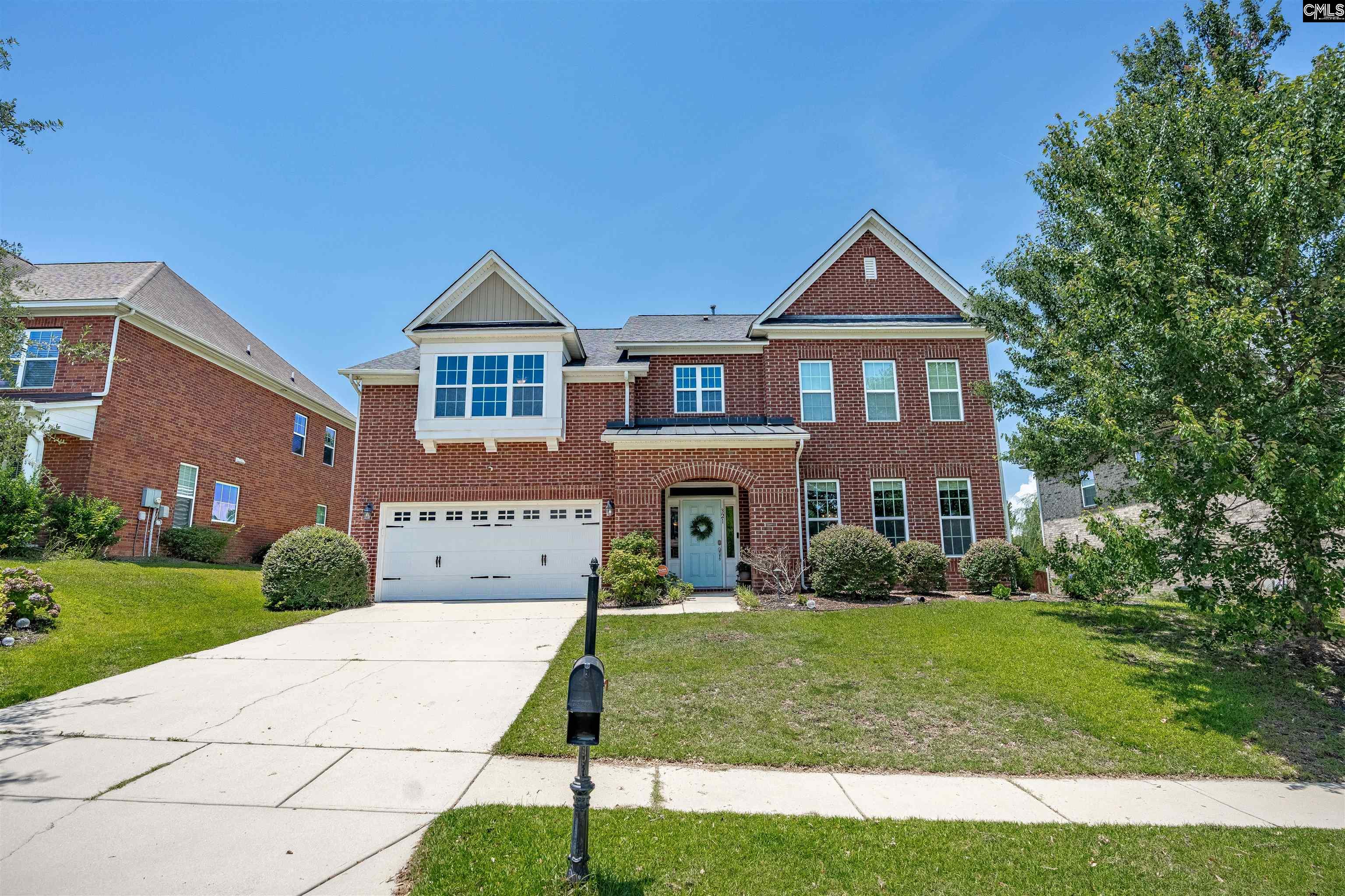 321 Asa Rose Lexington, SC 29072 - Photo 51 of 52 a front view of a house with garden