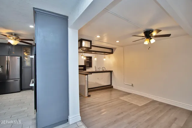 a view of a kitchen from the hallway
