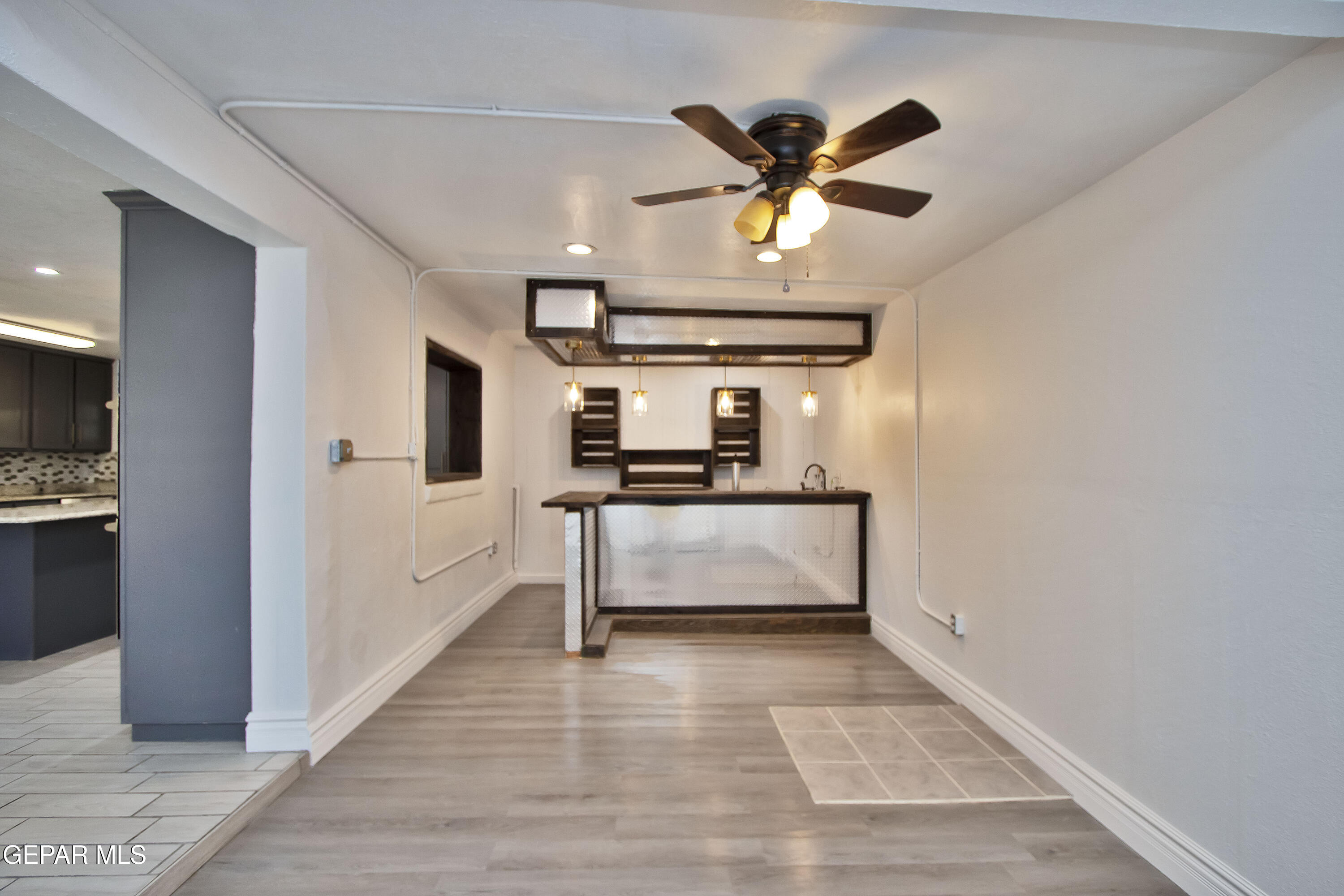 8415 Mt Ranier Drive El Paso, TX 79904 - Photo 22 of 69 a view of kitchen with cabinets and wooden floor