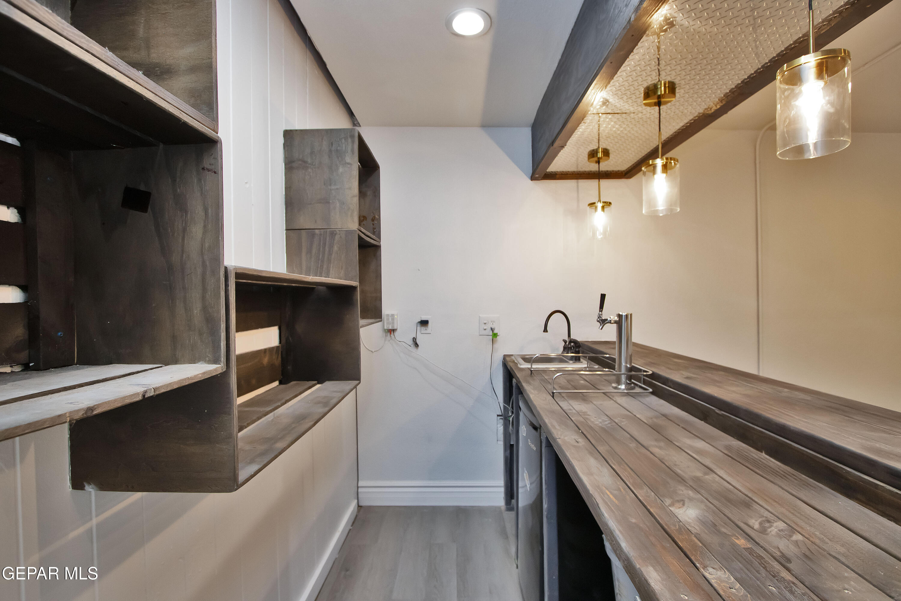 8415 Mt Ranier Drive El Paso, TX 79904 - Photo 25 of 69 a kitchen with a sink and cabinets