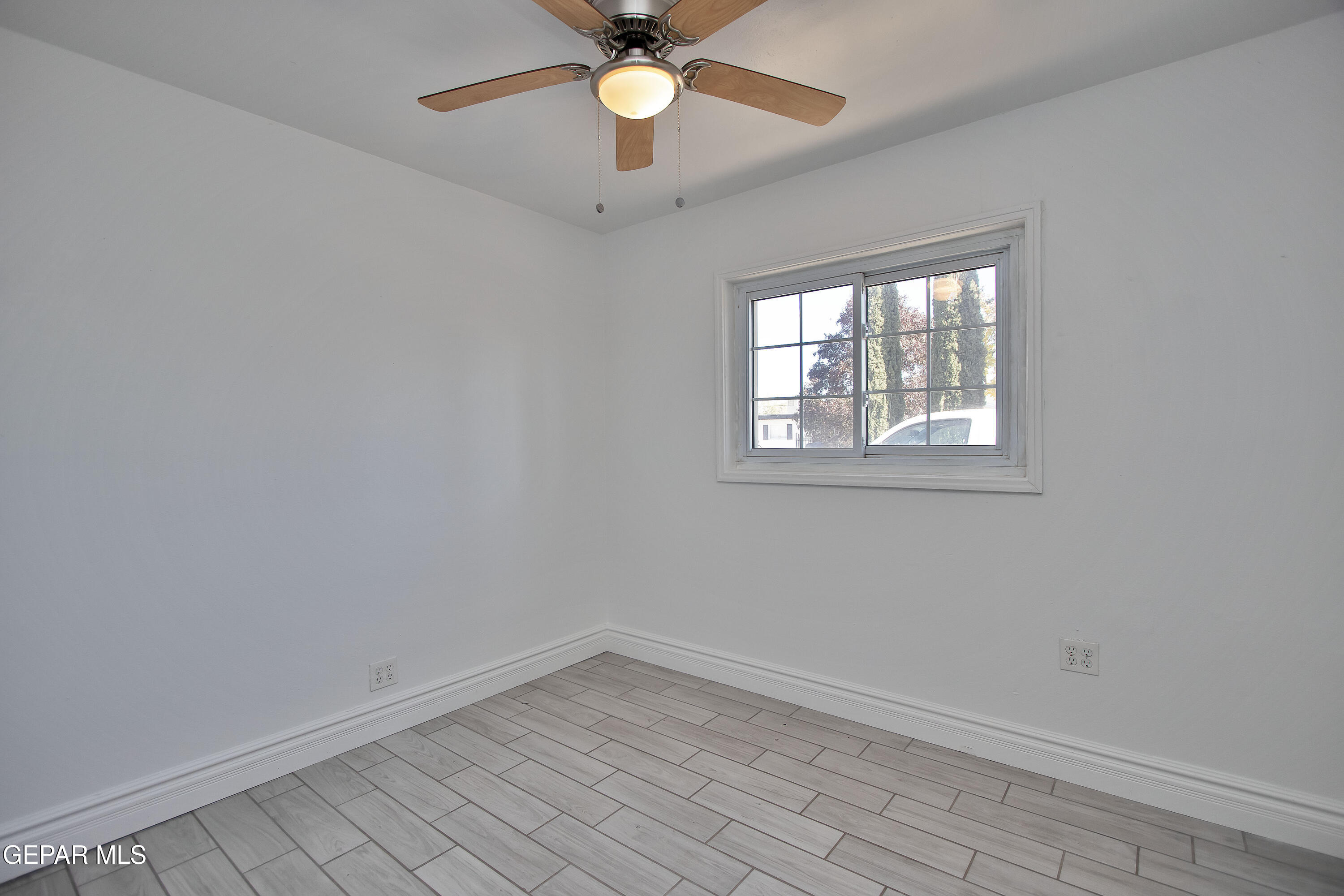 8415 Mt Ranier Drive El Paso, TX 79904 - Photo 33 of 69 an empty room with a window and a fan