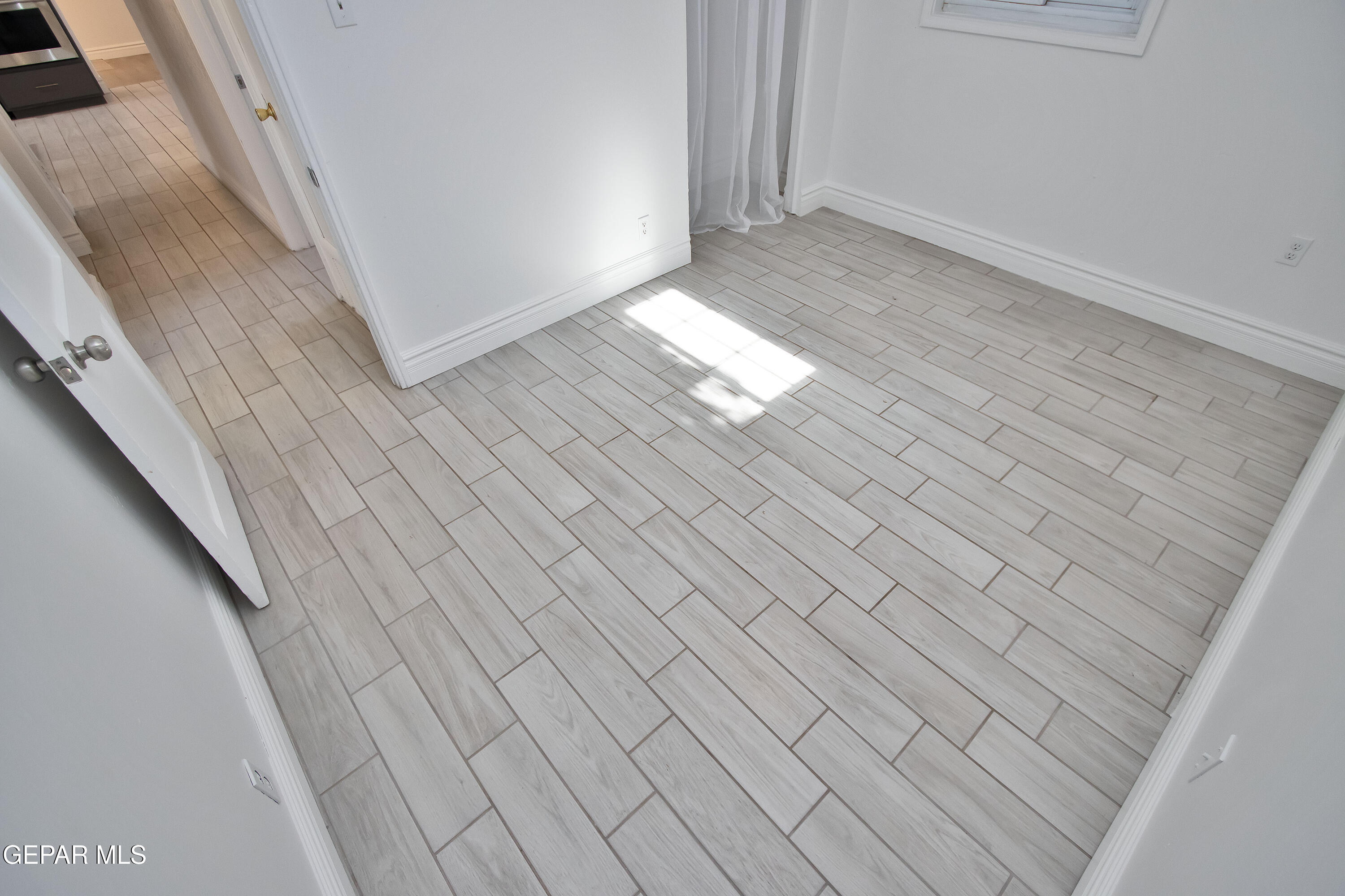 8415 Mt Ranier Drive El Paso, TX 79904 - Photo 41 of 69 a view of empty room with wooden floor