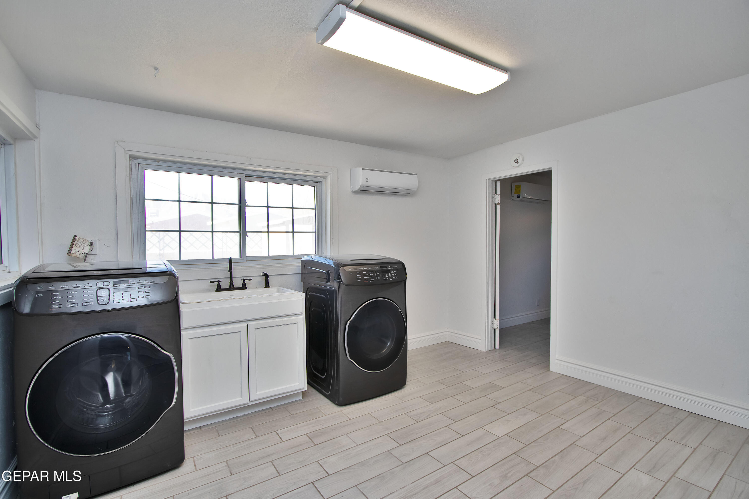 8415 Mt Ranier Drive El Paso, TX 79904 - Photo 45 of 69 a utility room with dryer and washer