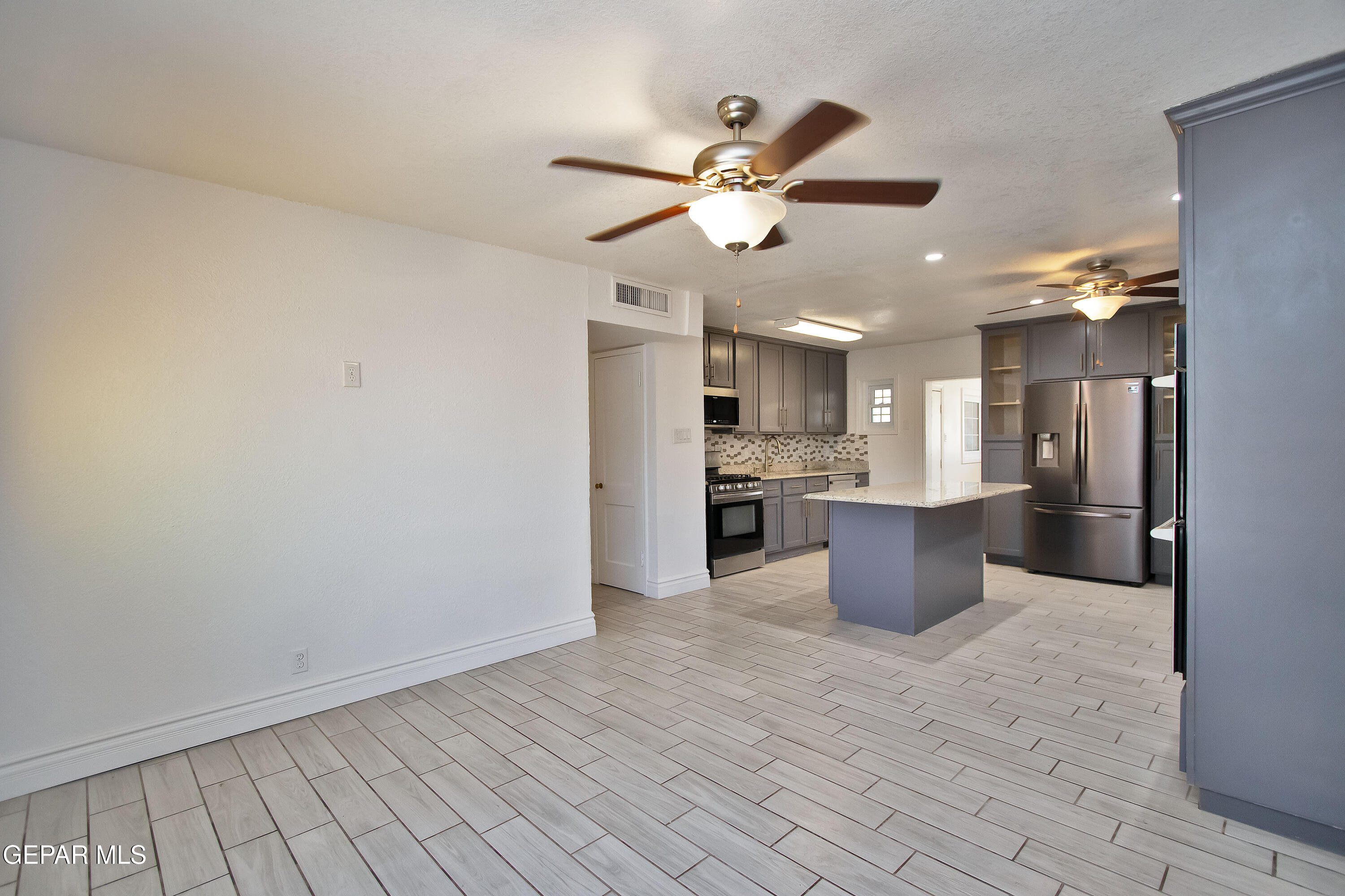 8415 Mt Ranier Drive El Paso, TX 79904 - Photo 10 of 69 a view of a kitchen with a sink cabinets and stainless steel appliances