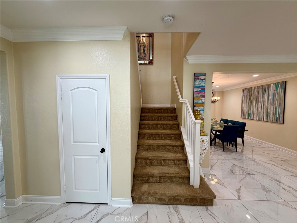13538 Applegate Court Rancho Cucamonga, CA 91739 - Photo 11 of 30 a view of entryway and hall with dining room