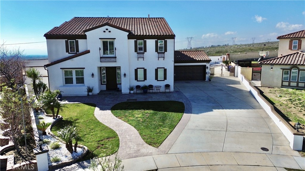 13538 Applegate Court Rancho Cucamonga, CA 91739 - Photo 2 of 30 a front view of a house with a yard