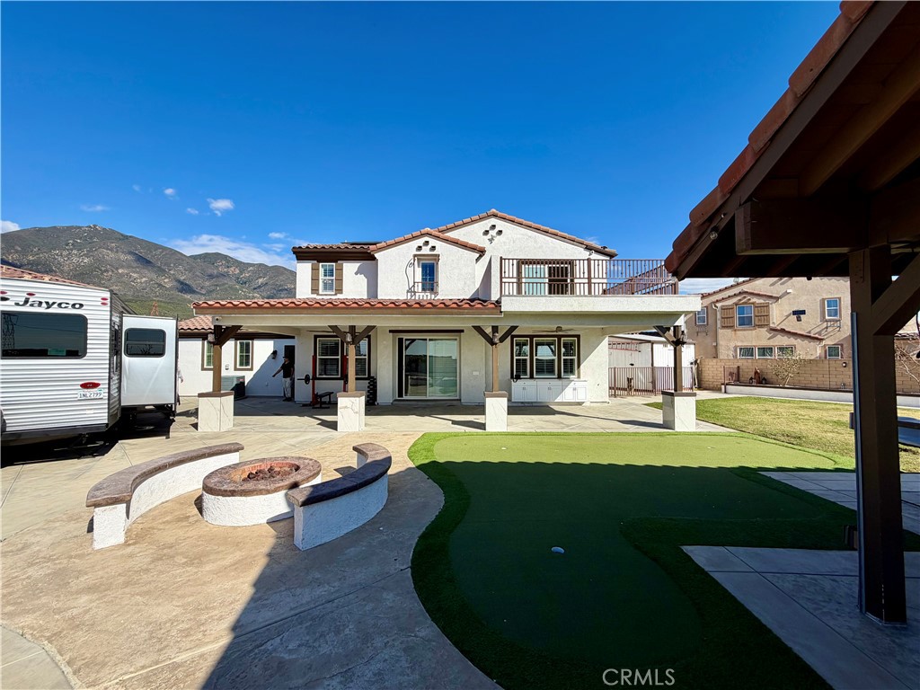 13538 Applegate Court Rancho Cucamonga, CA 91739 - Photo 24 of 30 a front view of a house with swimming pool having outdoor seating